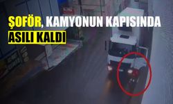 Şoför, kamyonun kapısında asılı kaldı