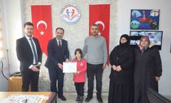 Tavşanlı'da dereceye giren öğrenciye tebrik ziyareti