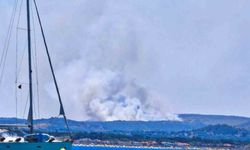Çeşme'de çöplükte çıkan yangın makilik alana sıçradı