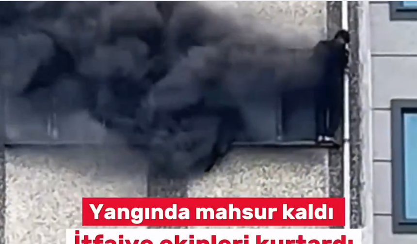 Çıkan yangında mahsur kalan kişi dış cepheye sığındı